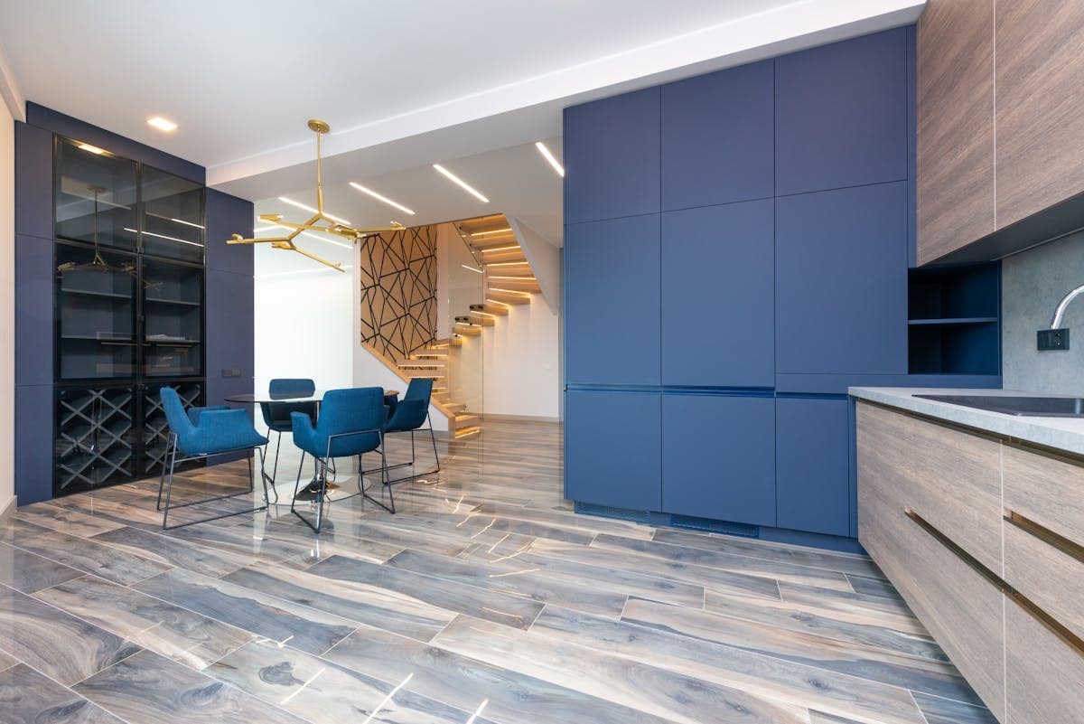 Modern indigo under-stairs cupboards with integrated kitchen finish in Douglas.